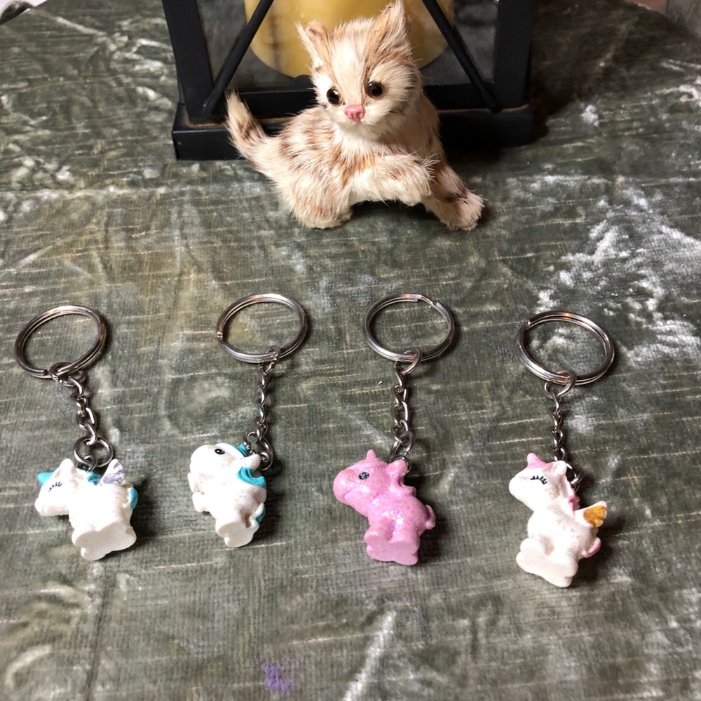Colorful Lot of Four Glittering Unicorn Keychains.